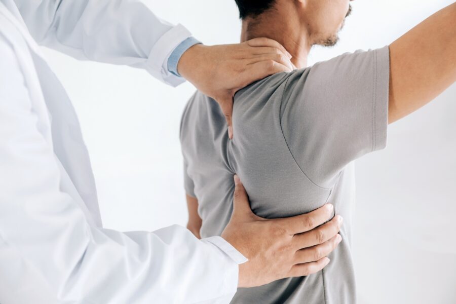 Physiotherapist,Doing,Healing,Treatment,On,Man’s,Back.back,Pain,Patient,,Treatment,